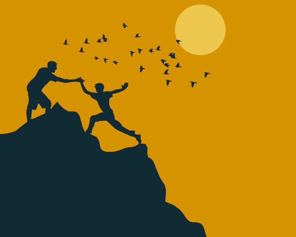Two silhouetted figures on a cliff, one helping the other reach up, with birds flying and a large sun setting in the orange background.